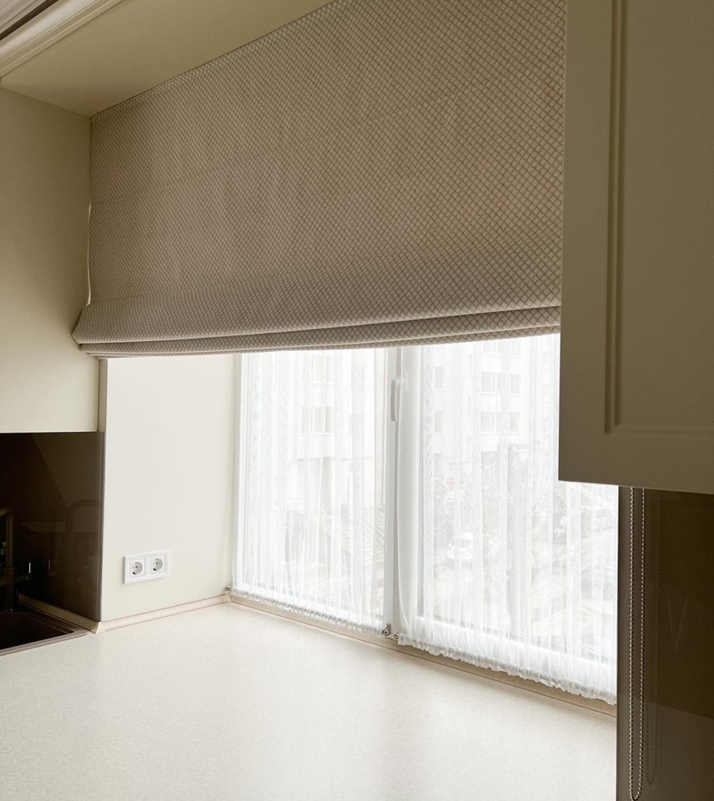 Roman blinds fitted to a living room window